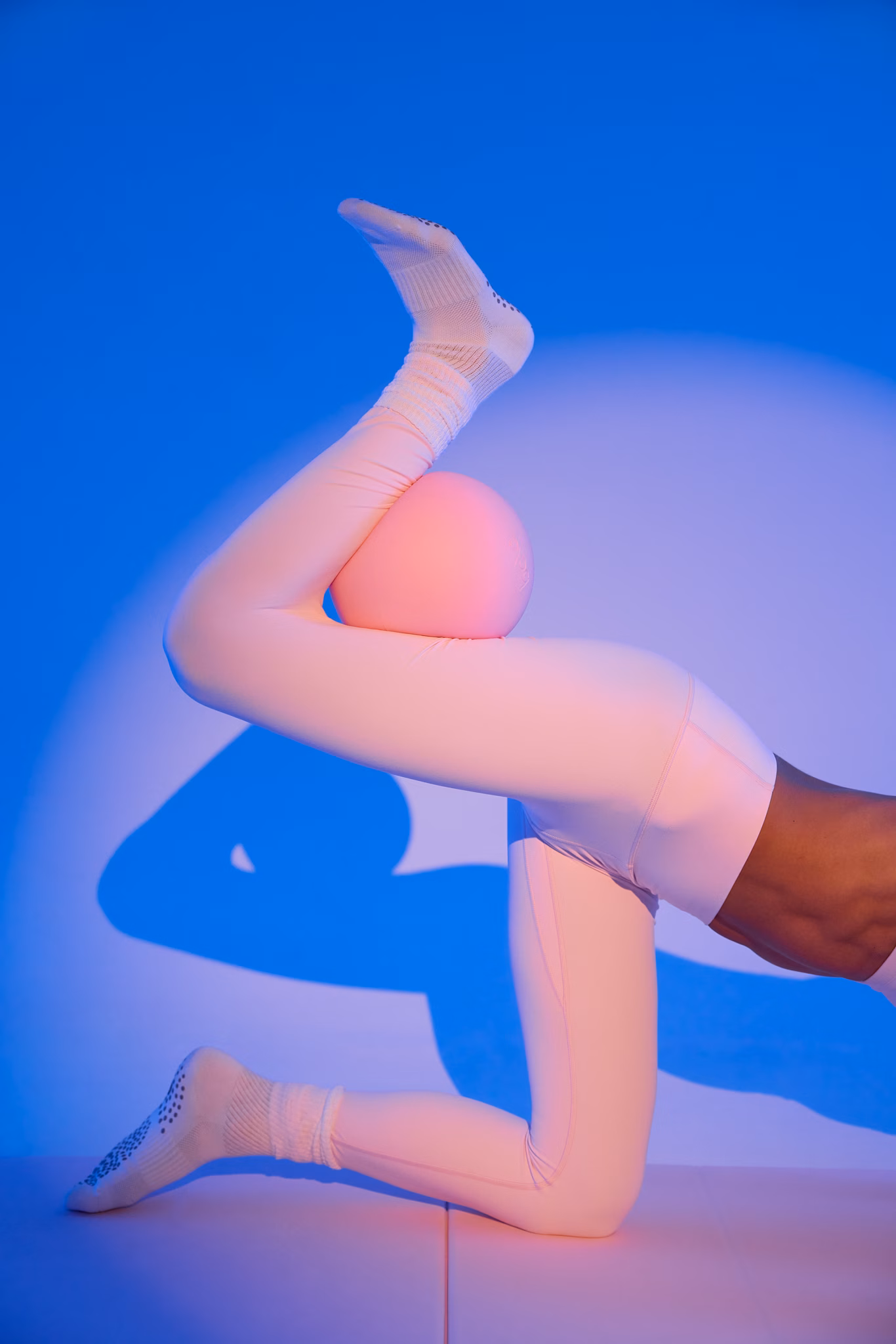 Instructor practicing Pilates